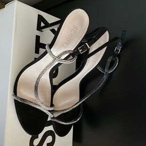 Schutz silver and black stilettos.
